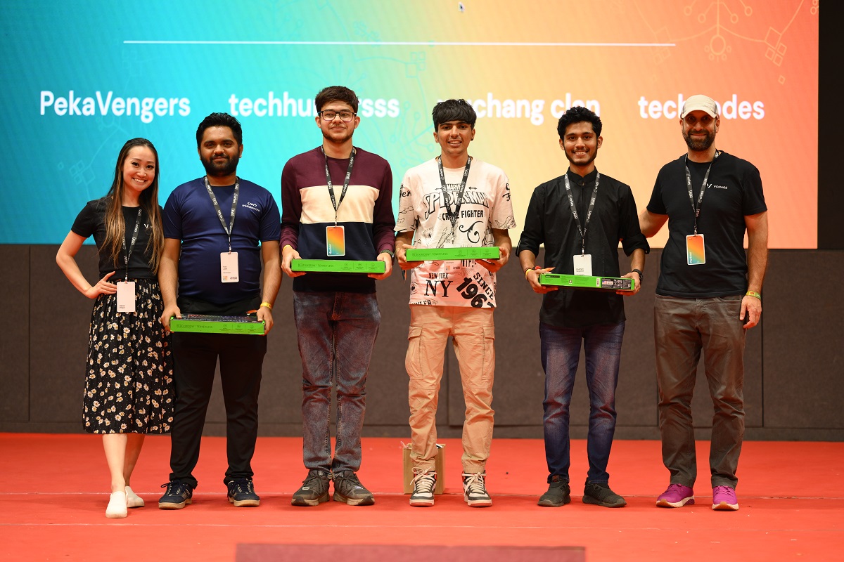 Winning team PekaVengers posing with their keyboard prize and Diana and Karl