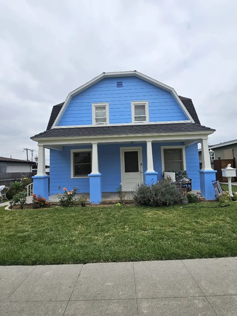 House exterior after painting — fresh blue paint, Long Beach CA