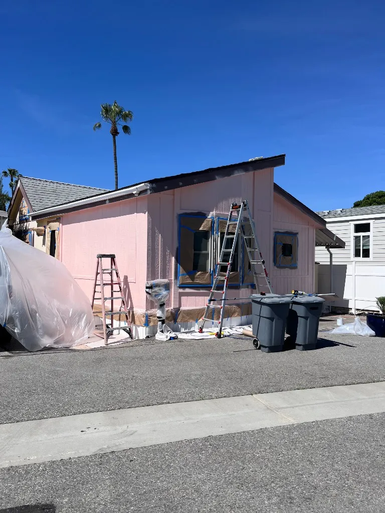 Mobile home painting in progress — professional prep work