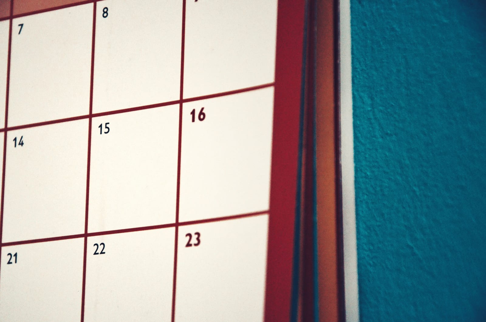 Close-up of a wall calendar grid with dates marked out Close-up of a wall calendar grid with dates marked out
