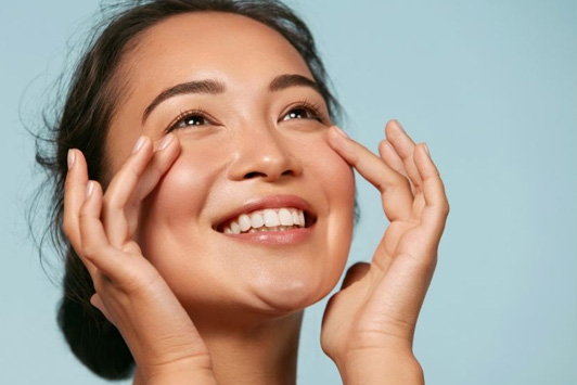 woman touching clear face