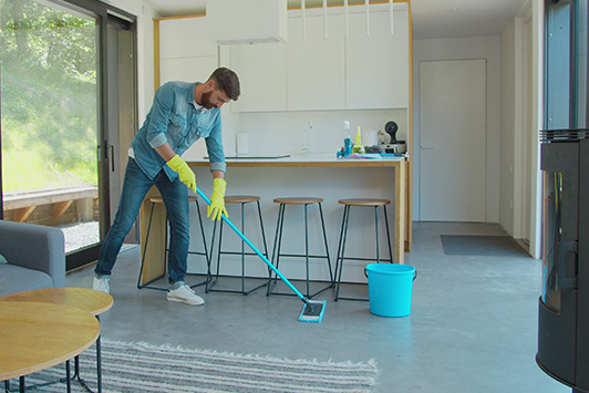 Man Mops Floor With Eco-Friendly Floorwash