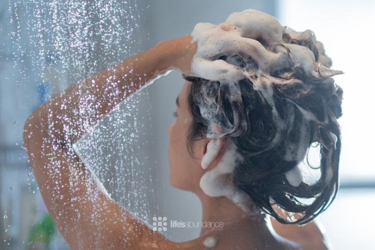 woman shampooing hair