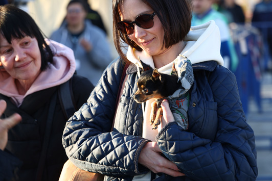 woman holding dog