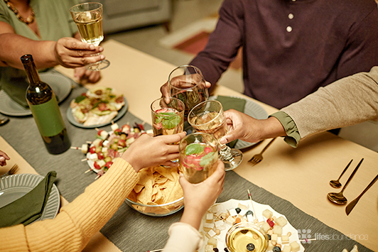 people toasting at family dinner