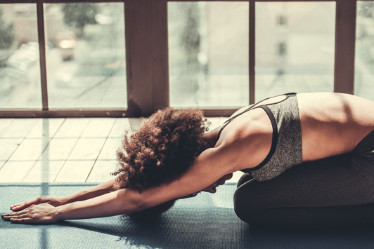 woman doing childs pose