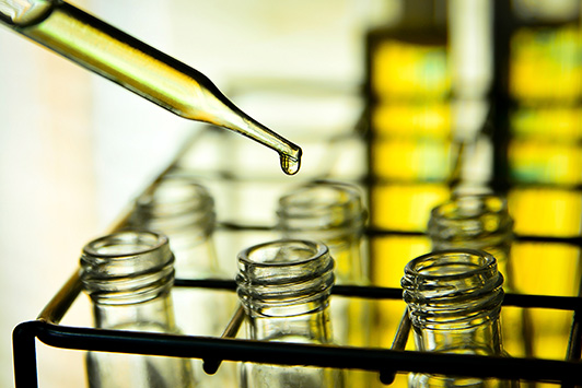 Hemp Seed Oil Being Dropped Into Vials
