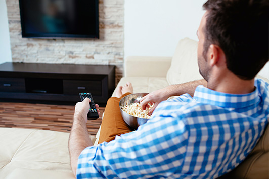 man watching television