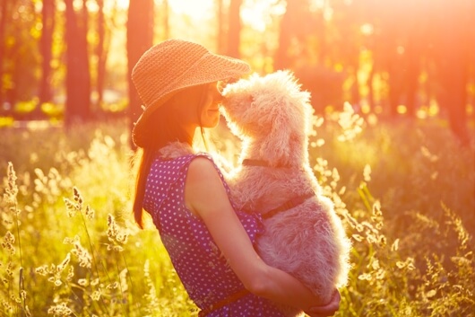woman-embraces-dog