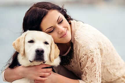 Girl hugging dog