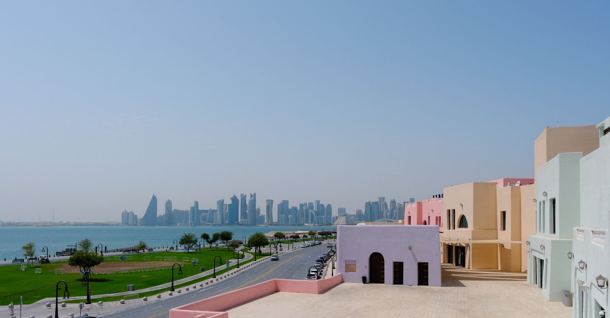Doha Corniche at sunset with modern skyline