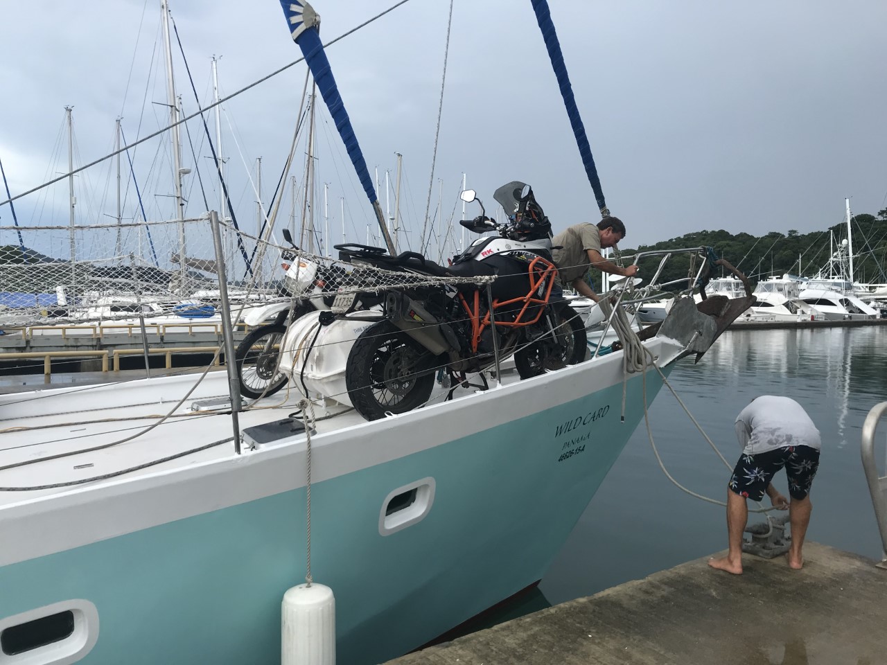 Loading the motorbike onto the boat in Puerto Lindo, Panama
