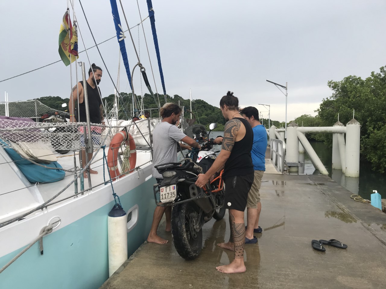 Loading the motorbike onto the boat in Puerto Lindo, Panama