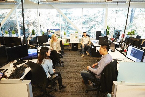 googlers talking in open space office googlers talking in open space office