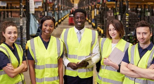 various_Vectrus_workers_in_yellow_vests various_Vectrus_workers_in_yellow_vests