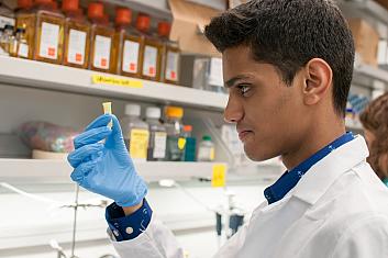 Man performing lab test Man performing lab test