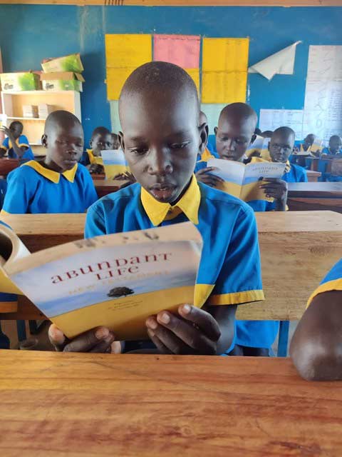PEACE child reading his Bible