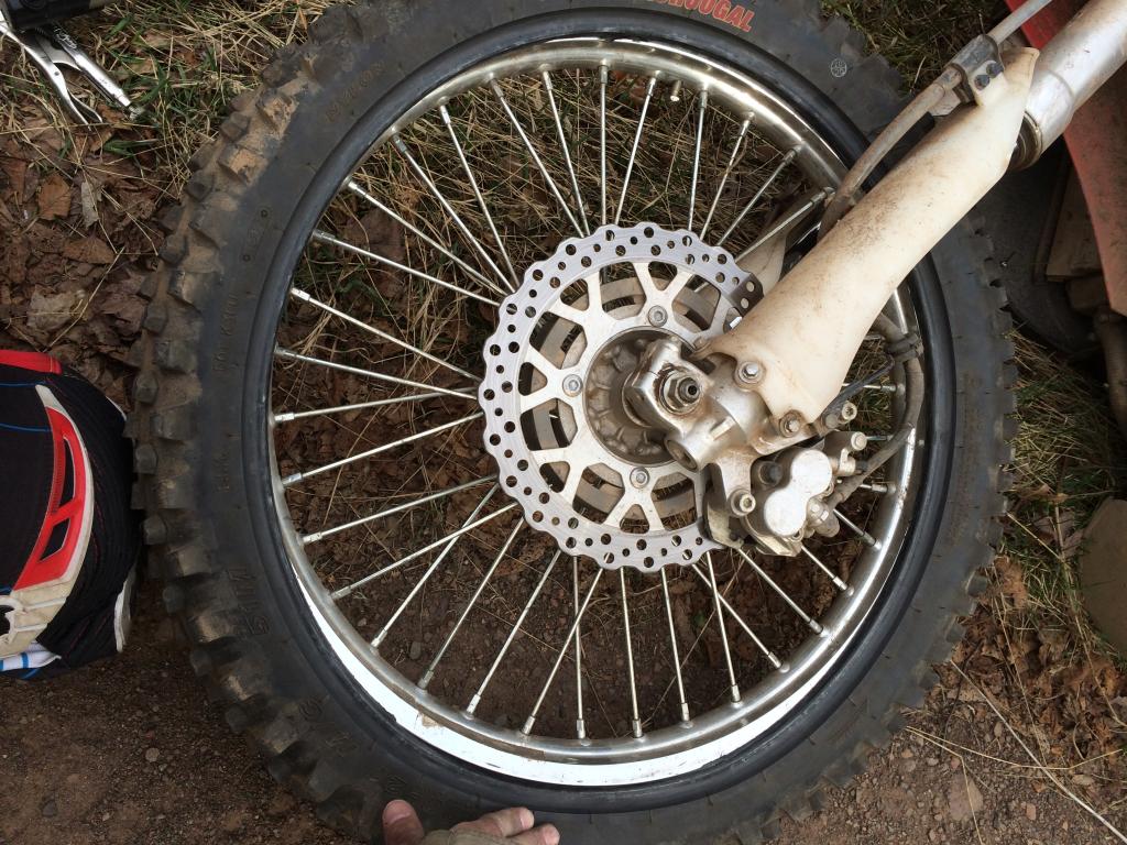 Trail side tube repair while wheel remains mounted to motorcycle