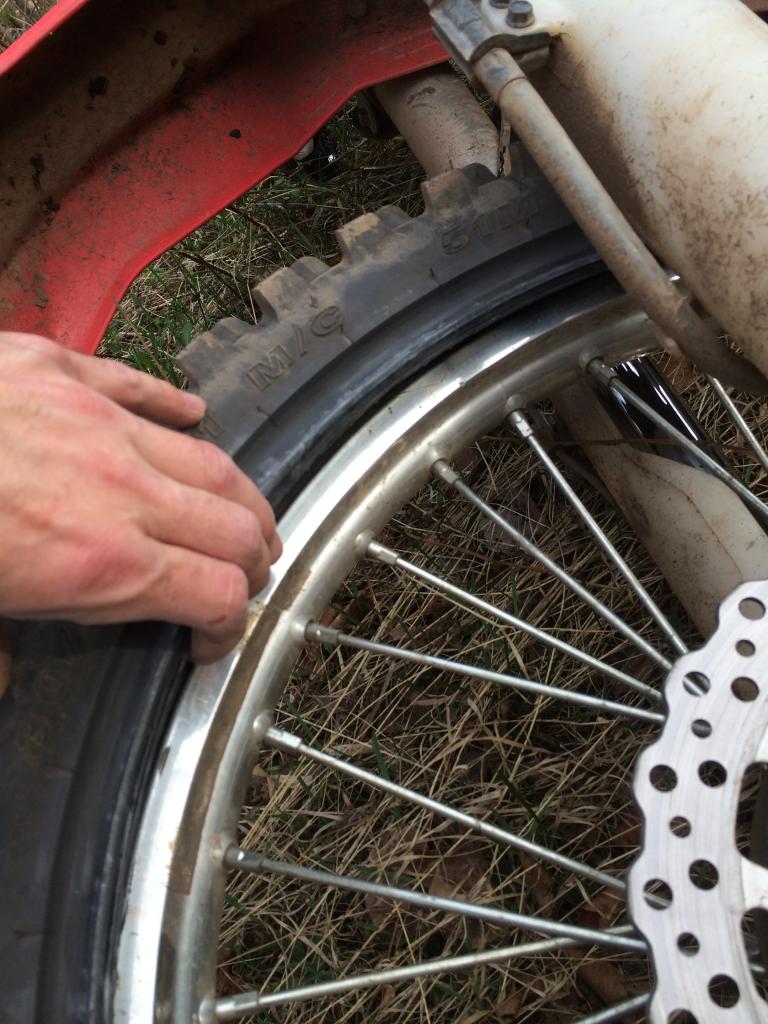 Trail side tube repair while wheel remains mounted to motorcycle