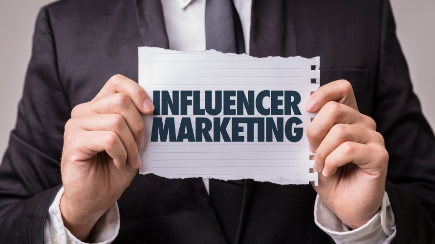 ManHoldingInfluencerMarketingSign