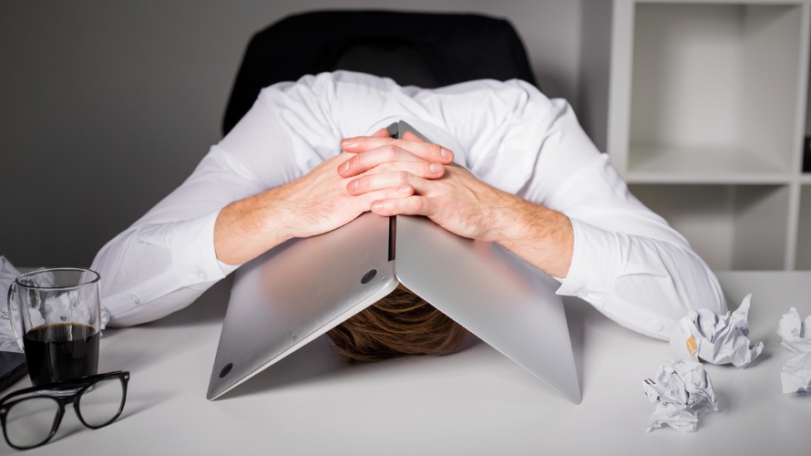 ManHidingUnderLaptop