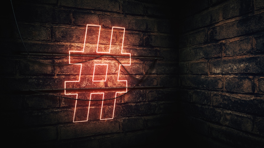 Hashtag Neon Sign mounted on brick wall, illustration