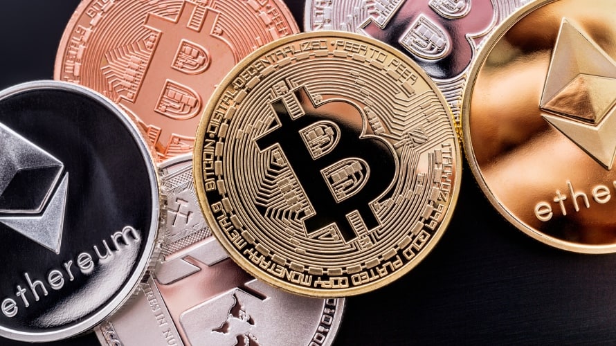 Stacked cryptocurrency coins (Bitcoin, Ethereum, Litecoin)