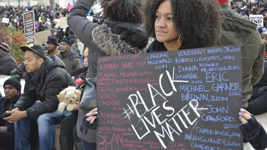 WomanWithBlackLivesMatterSign