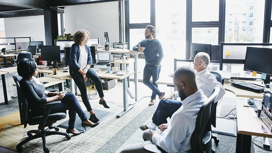 Businessman leading project meeting in high tech office