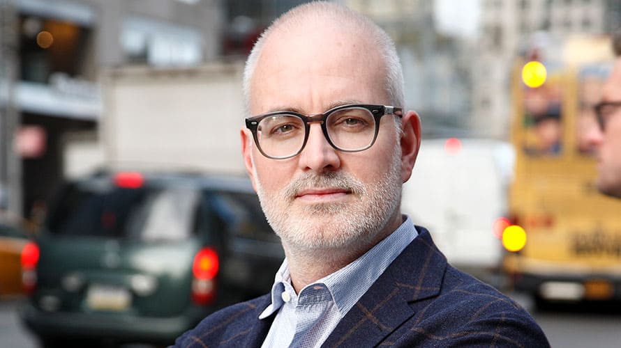 hearst-troy-young-content-2018 a bald man with glasses