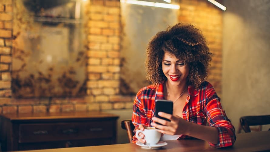WomanFlannelSmilingSmartphone