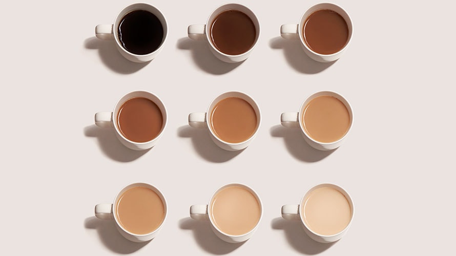 racial-diversity-nuance-content-2019 9 cups of coffee arranged in three rows of three; starting from the top left the cups of coffee go from black coffee to lighter coffee