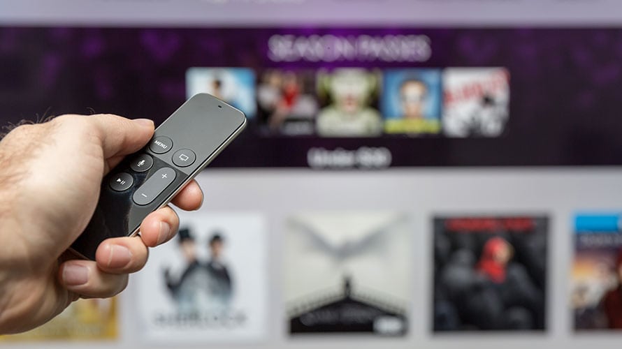 OTT-strategy-for-cord-cutters-content-2019 A person points a remote at a television