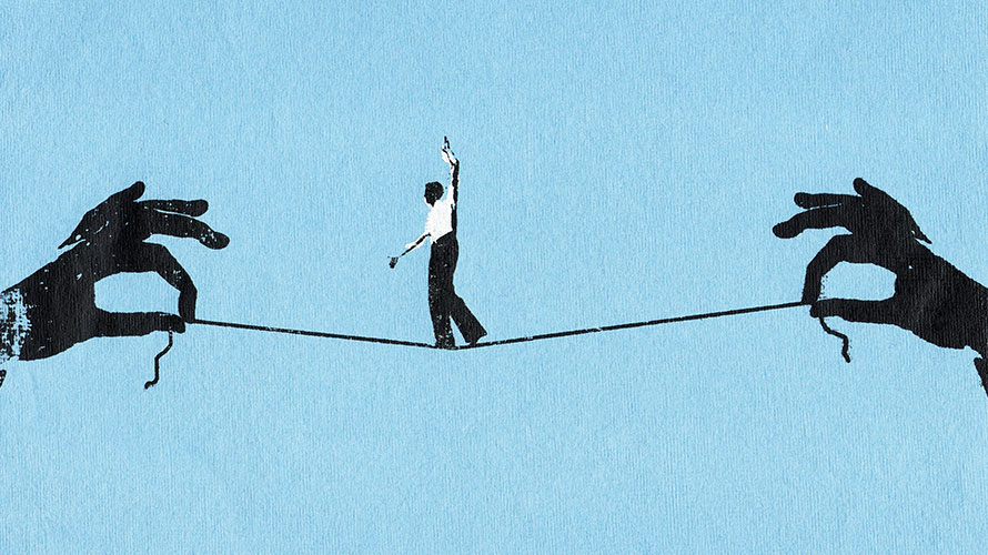 trust-drives-marketing-strategies-content-2019 A man balances on a string; he is tight rope walking; the string is held up by two hands on each side