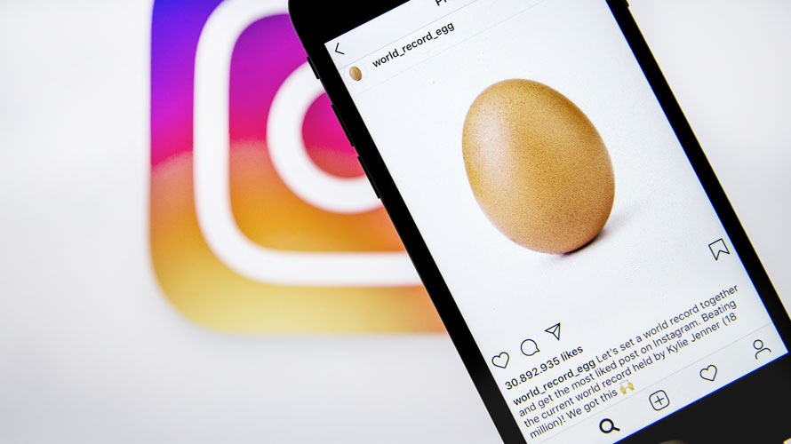 record-egg-ig-CONTENT-2019 Background is the instagram logo; from the right corner is an Instagram post with 30 billion likes; the post is of an egg