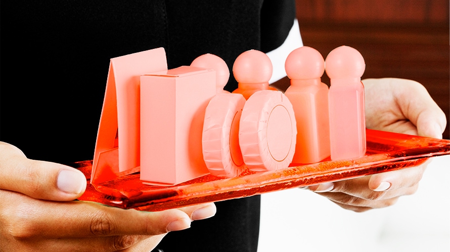 mini-soaps-content-2019 hotel maid carrying tray of miniature soaps and shampoos