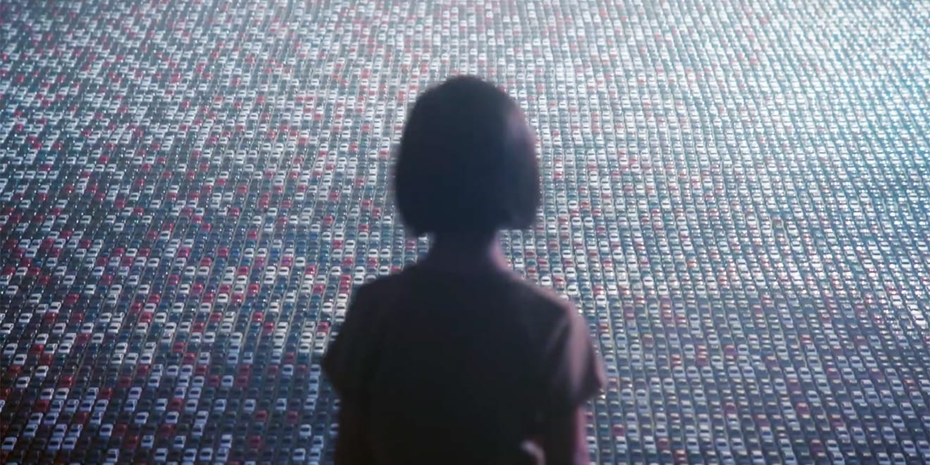 30000-toy-cars-mass-transit-2019 A child looks at thousands of toy cars.