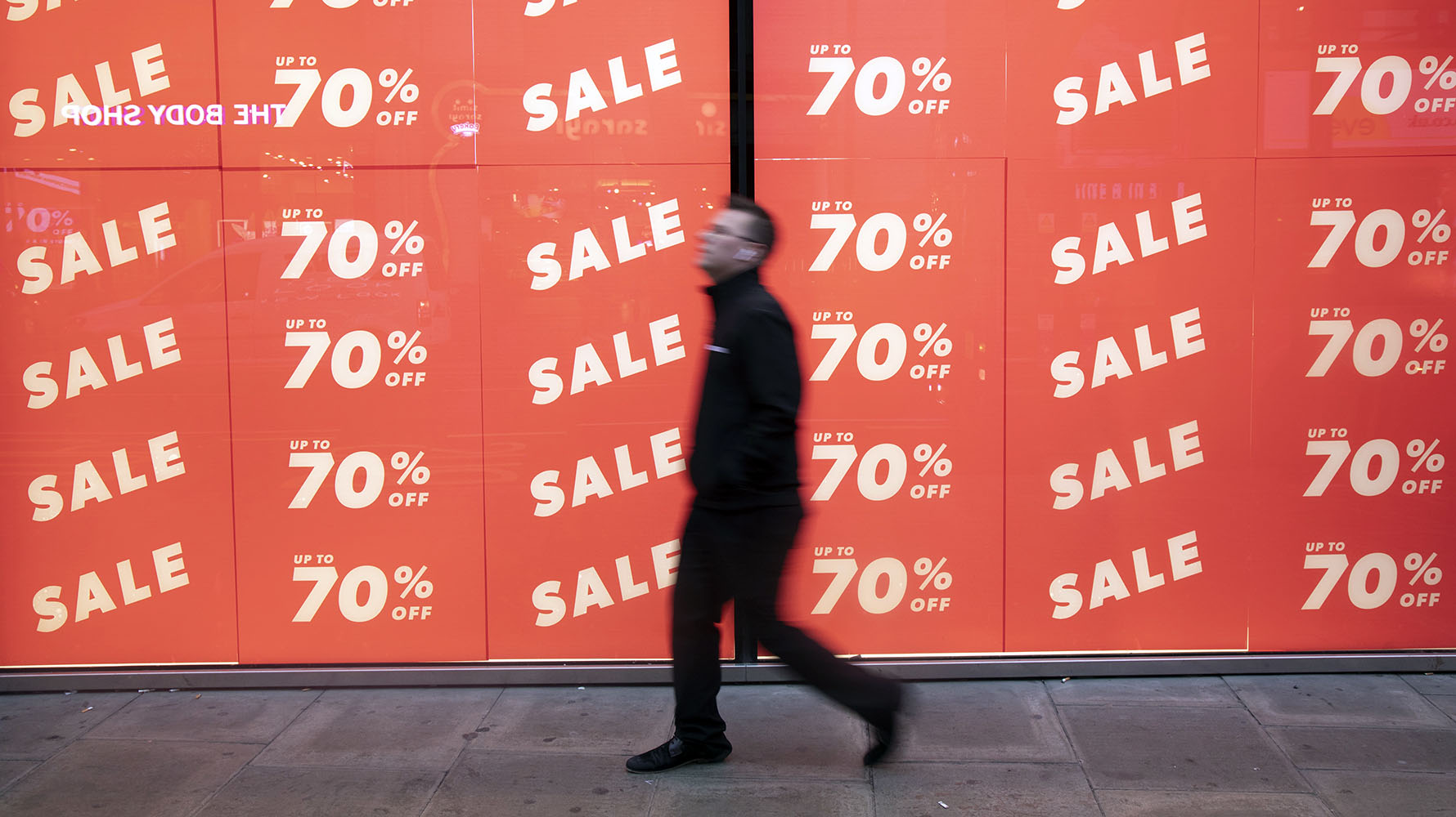 January Sale On Oxford Street In London 2019 People out shopping on Oxford Street walk past large scale January sale signs in red and white for major high street clothing retail shops on 7th January 2019 in London, United Kingdom. Its time for the Winter sales, and most shops are advertising big reductions in prices. Bargains are available and the shopping streets are busy. Oxford Street is a major road in the West End of London. It is Europe