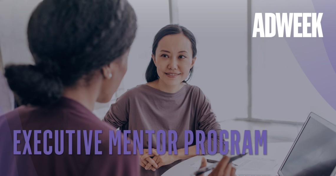 Series_Executive-Mentorship Women look at each other in a meeting. Text says Executive Mentor Program.