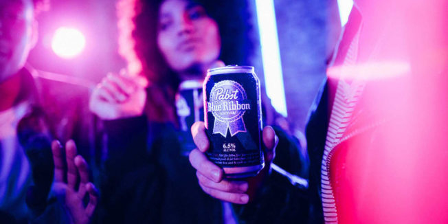72andsunny-wins-pbr-PAGE-2020 a woman holding a can of PDR