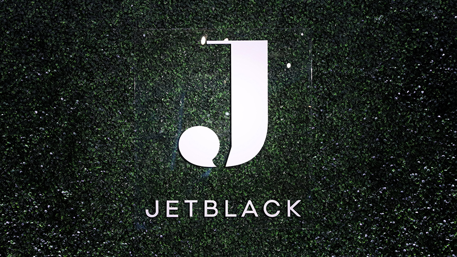jetblack-content-2020 White Jetblack logo on greenish-black background