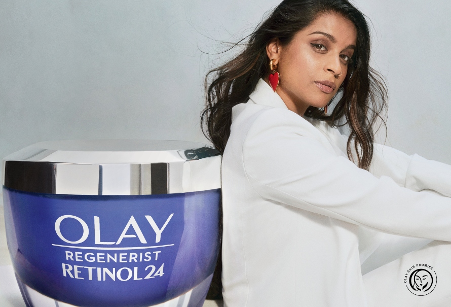An image of Lilly Singh featuring Olay's "Skin Promise" seal