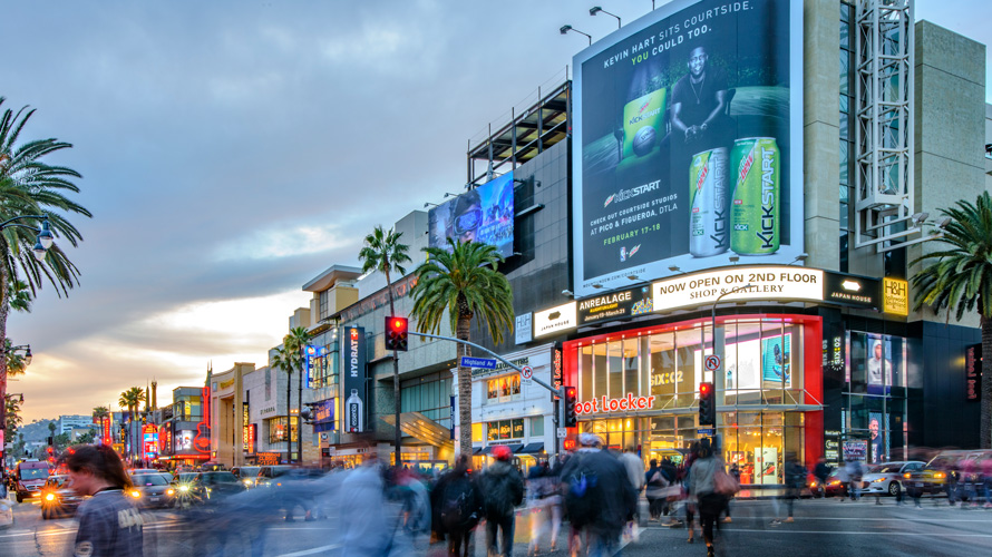 billboards-more-valuable-airport-CONTENT-2020 a street with brightly lit advertisements