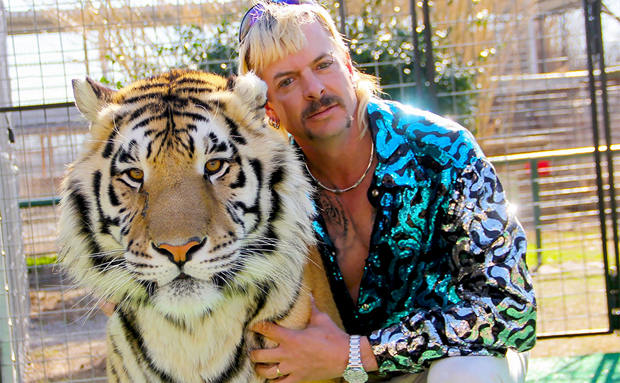 netflix-tiger-king-earnings-2020 Photo of Joe Exotic and a tiger