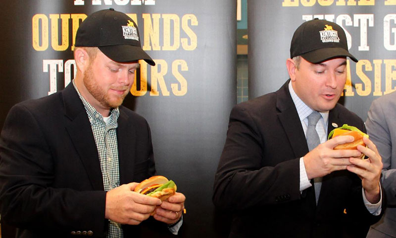 Nathan Lawson, left, a Kentucky beef cattle producer, and Agriculture Commissioner Ryan Quarles enjoyed some Kentucky Proud beef at an event in Lexington.