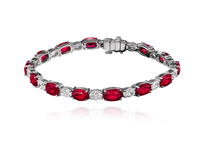 Oval ruby and oval cut diamond bracelet in platinum.