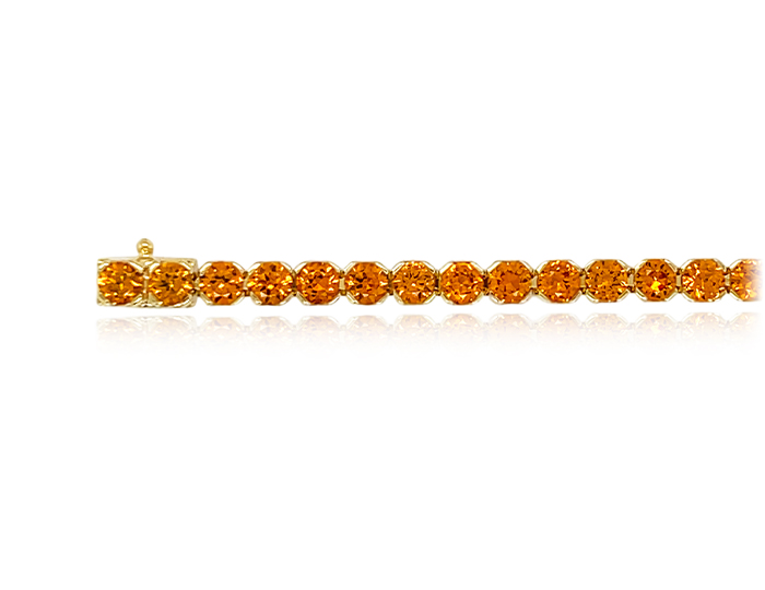Round spessartite bracelet in 18k yellow gold.