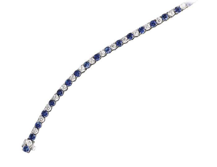 Round sapphire and round brilliant cut diamond bracelet in 18k white gold.