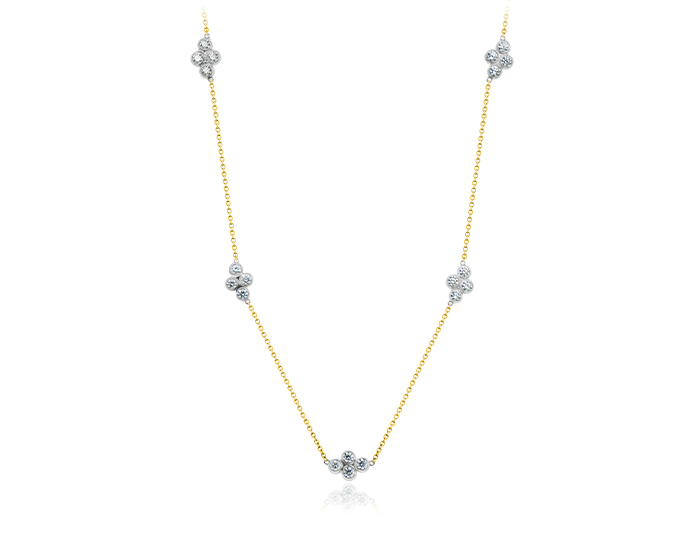 Round brilliant cut diamond necklace in 18k white and yellow gold.