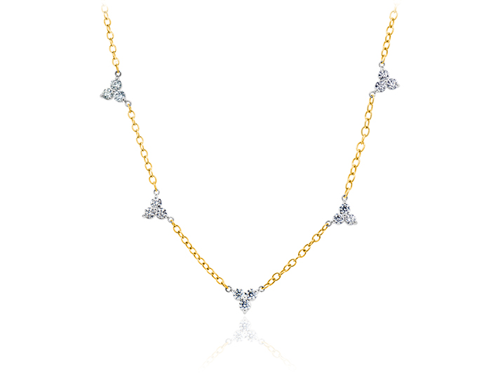 Round brilliant cut diamond necklace in 18k white and yellow gold.
